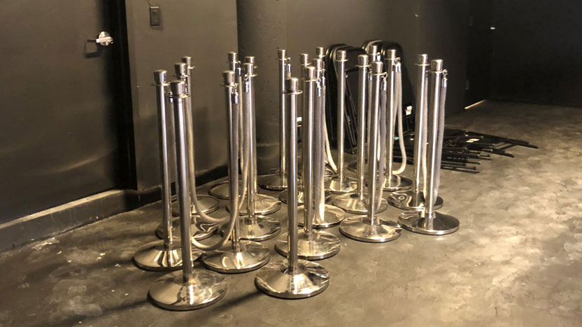chrome stanchions and museum ropes